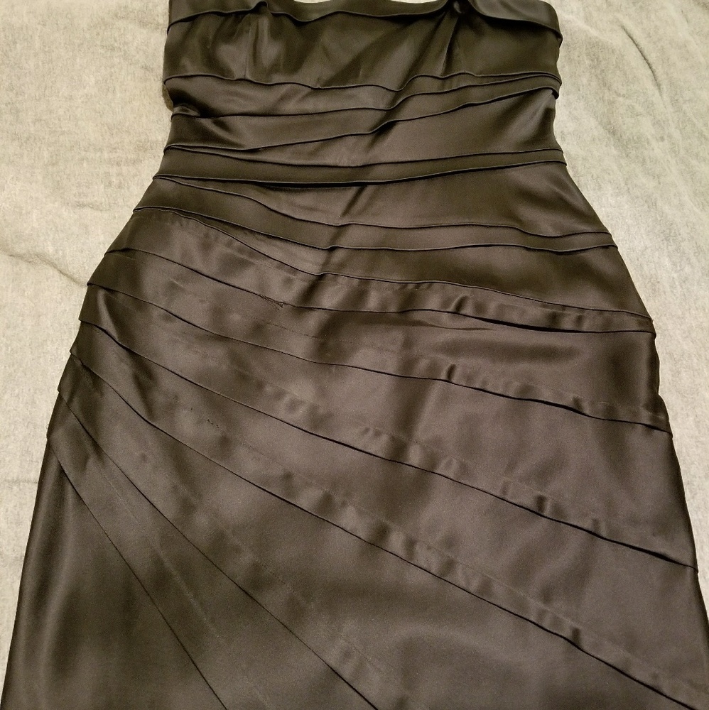 Black cocktail dress with removable straps.